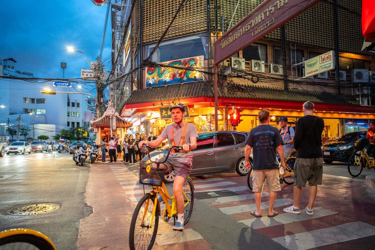 Cyclists on the Night Cycling & Street Food tour in Bangkok