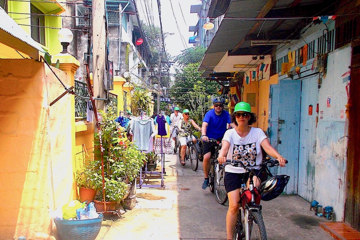 Cyclists on the Small-group City & Snacks tour in Bangkok
